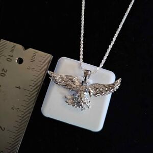 .75CTW VVSD Moissanite Eagle pendant in 925 sterling silver on 20" chain.